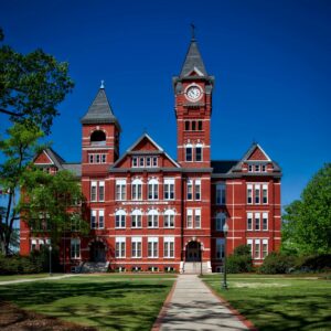 Front view of Samford Hall, Auburn University, with its iconic clock tower on a sunny day.